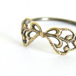 Delicate filigree ring. Sterling silver and vintage brass filigree bow.